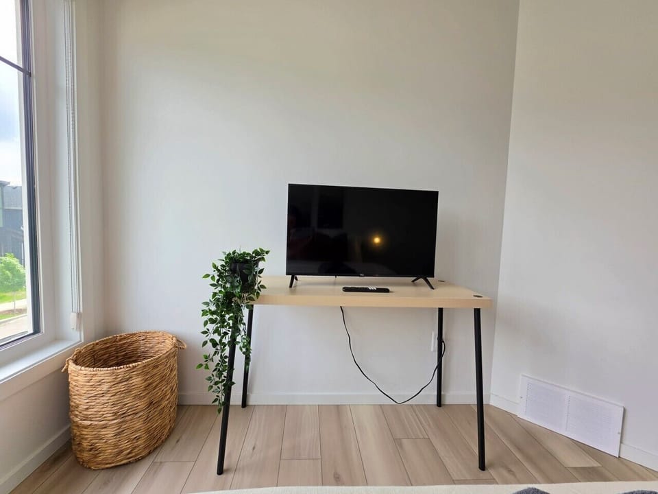 Primary Bedroom with Ensuite, Walk Through Closet and Smart TV