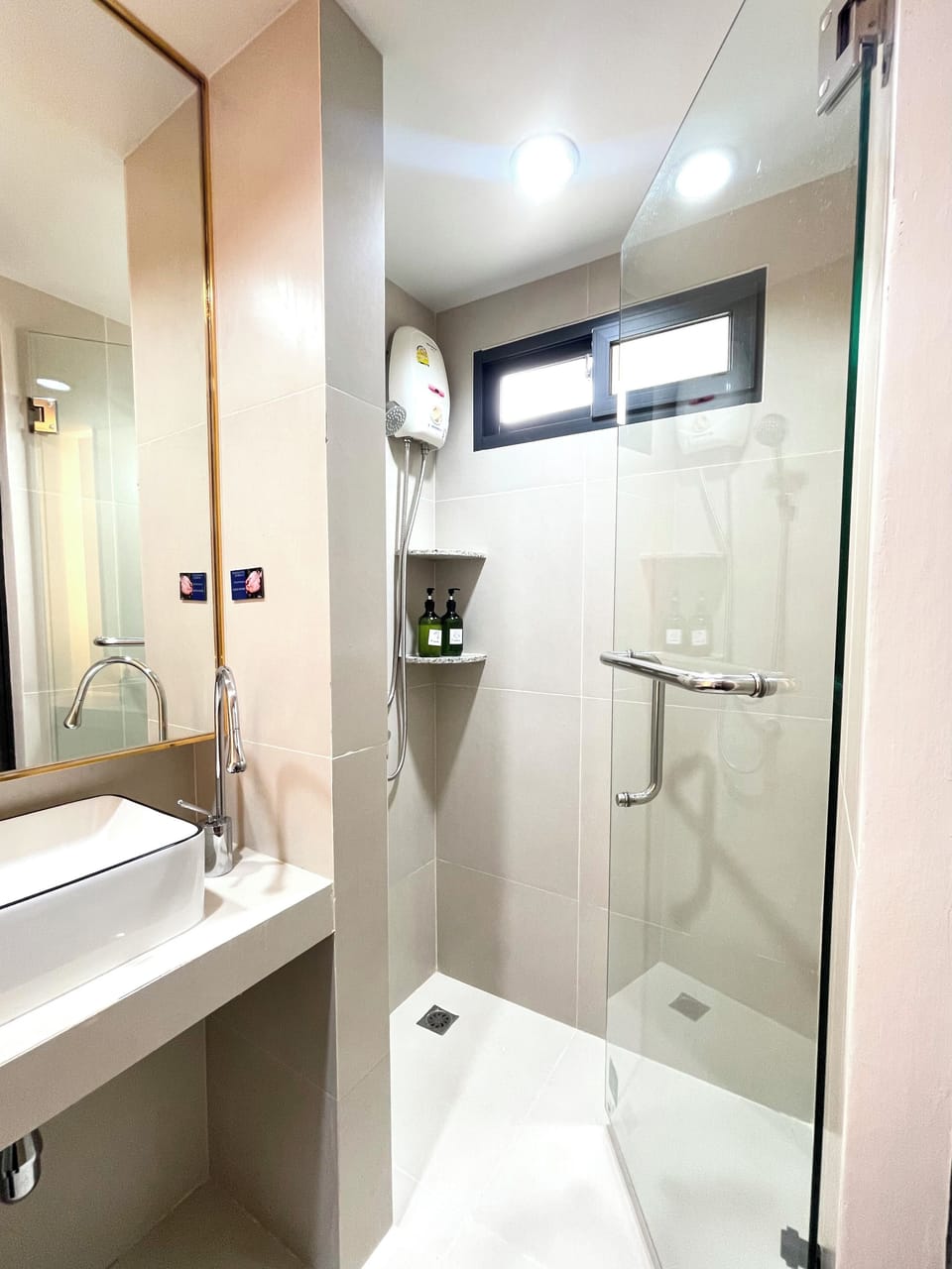 Shower, hair dryer, slippers, towels