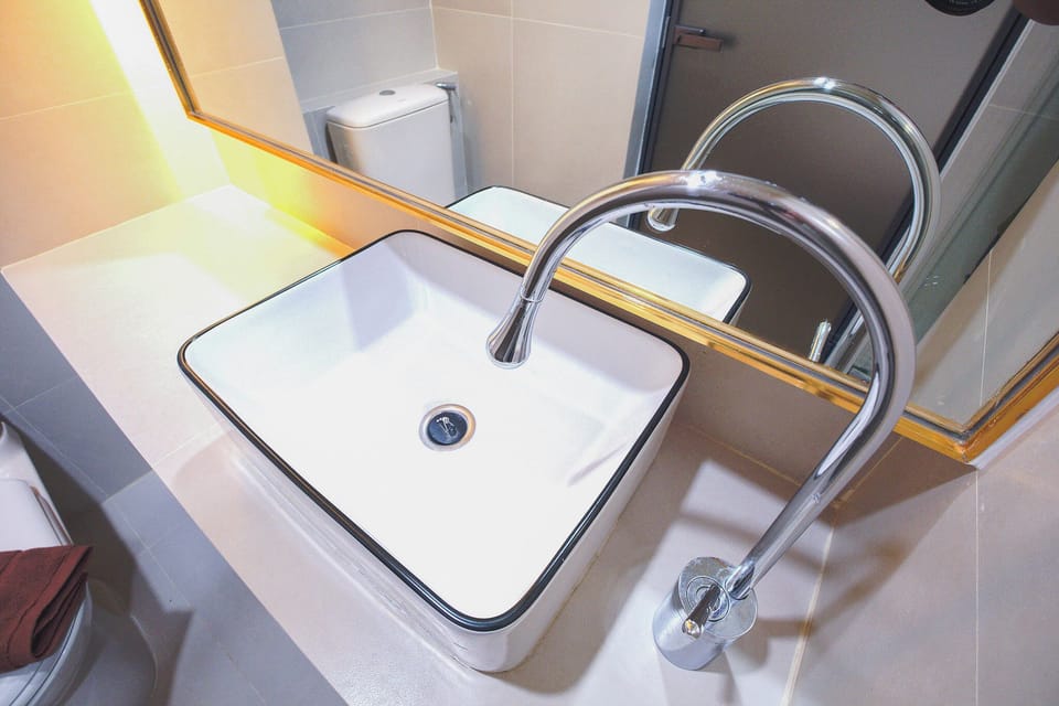 Twin Room, City View | Bathroom | Shower, hair dryer, slippers, towels