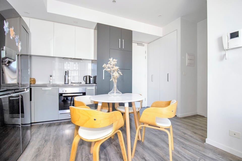 Bright modern kitchen with cozy dining nook and sleek finishes