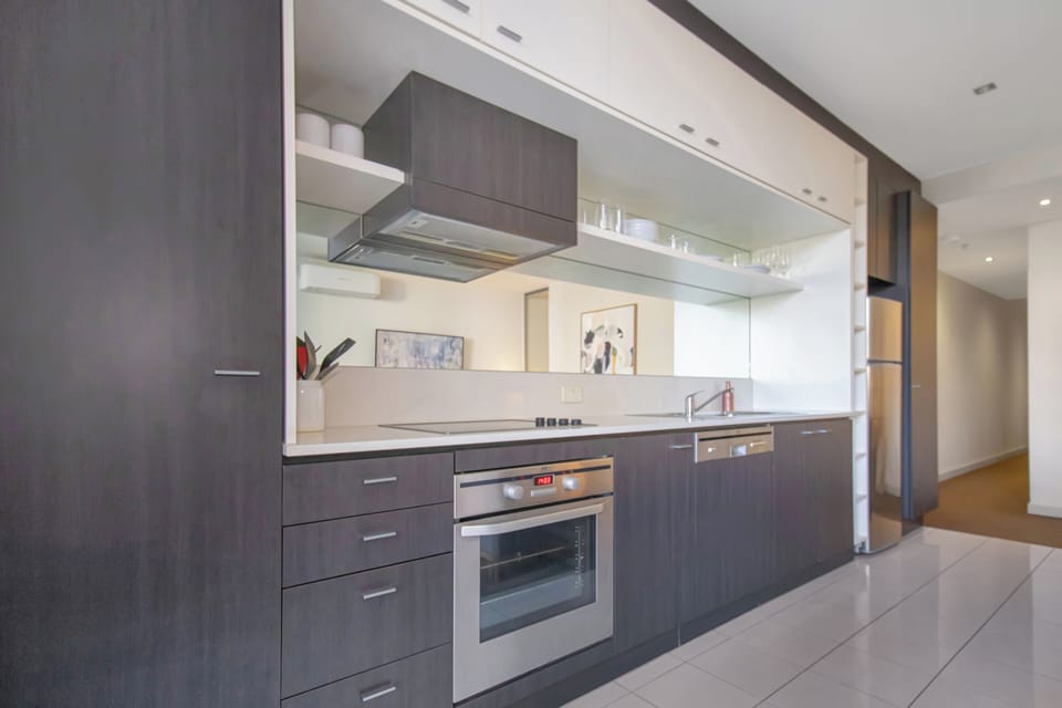 Sleek modern kitchen with stainless appliances and ample storage