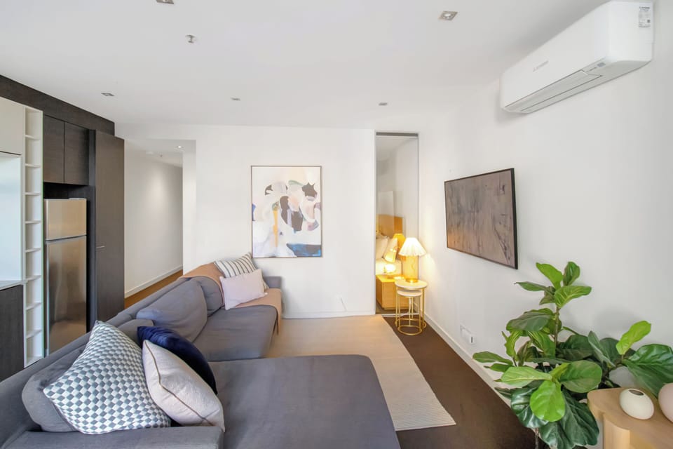 Bright modern living space with cozy sectional and sleek open layout