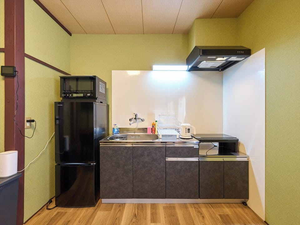 Apartment, 2 Bedrooms, Non Smoking | Private kitchen | Full-size fridge, microwave, stovetop, cookware/dishes/utensils