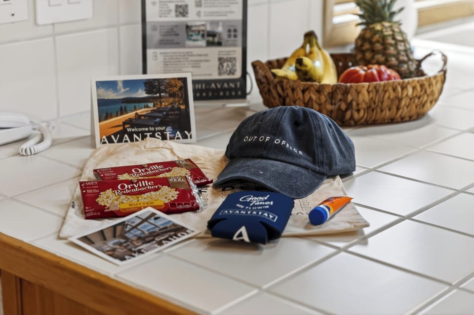 Thoughtful guest welcome display on the kitchen countertop, highlighting local charms and curated amenities.