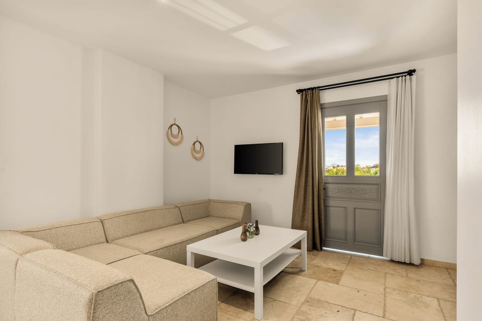 Junior Suite, Balcony, Pool View | Living area | 55-inch LED TV with satellite channels