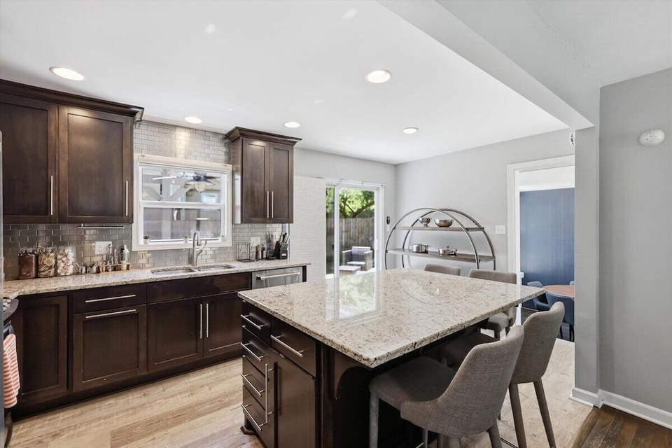 Gather around the oversized island for morning coffee, meals, or planning your Kansas City adventures.