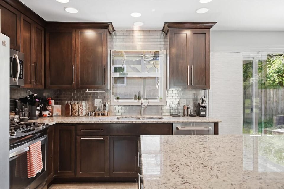 Granite countertops and ample prep space make cooking easy during your stay.