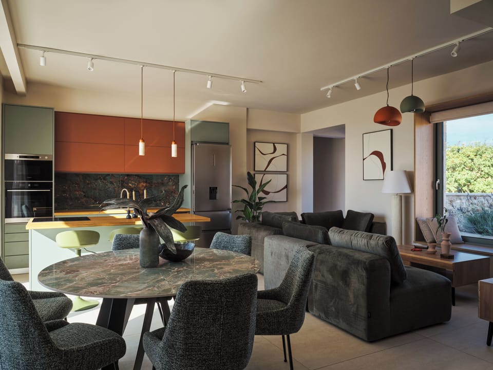 An open-plan living room and fully equipped kitchen set the tone for effortless 