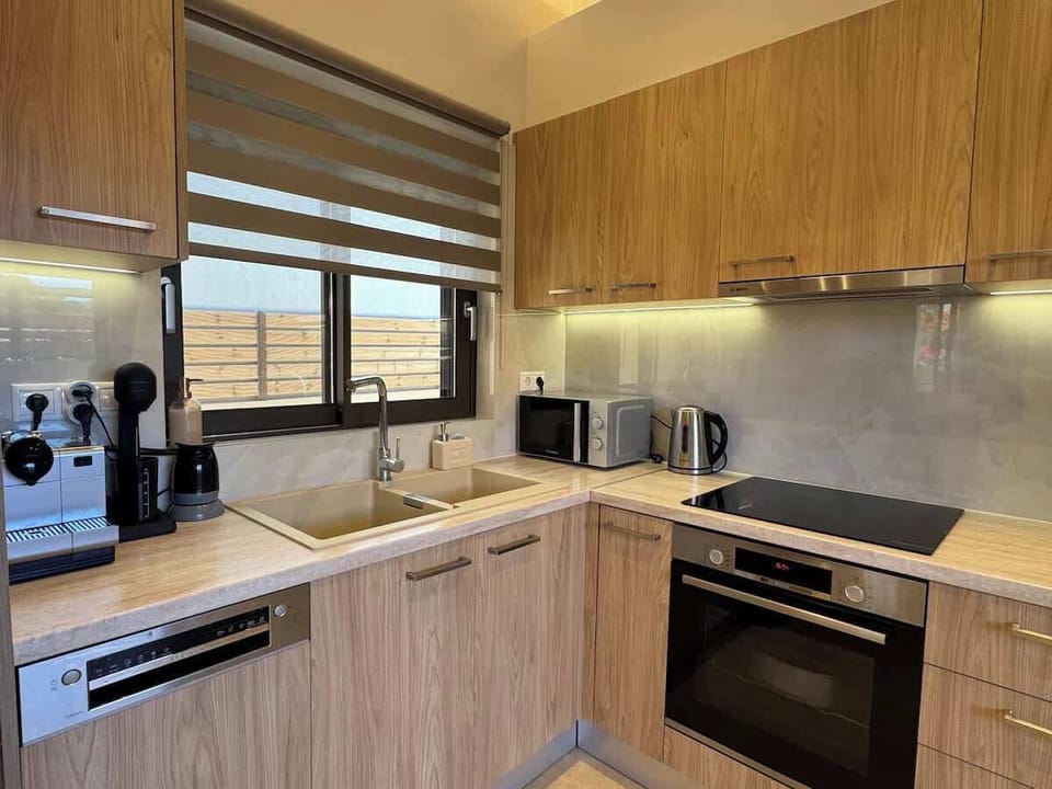 A kitchen with all the necessary appliances for your stay