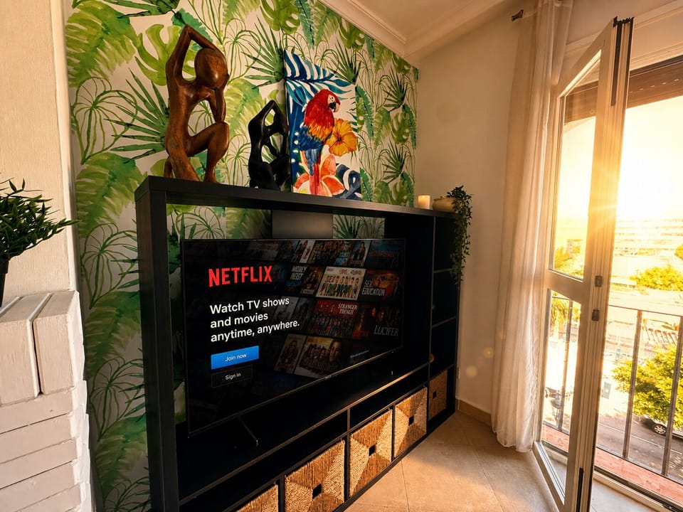 Bright Living Room With Tropical Wallpaper