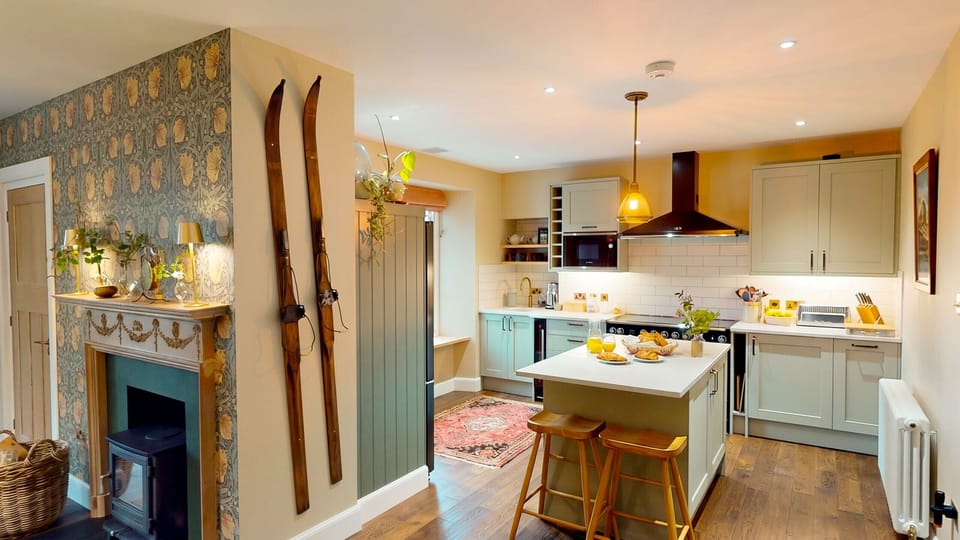 A fully equipped kitchen with a large island makes cooking for a crowd a pleasure — everything you need for a brilliant self-catering stay.