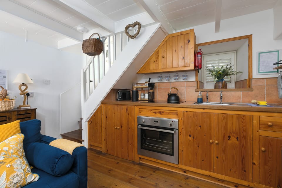Characterful cottage kitchen equipped for a comfortable self-catering stay