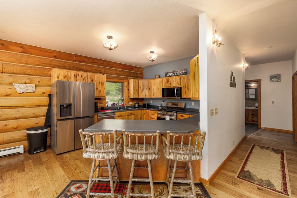 Rustic kitchen with breakfast bar seating | Main Level