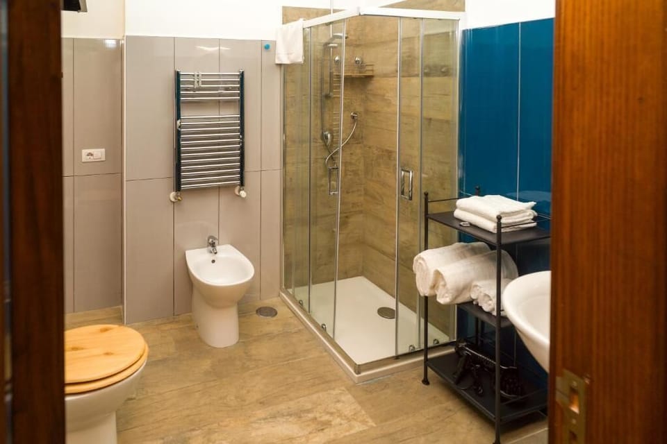 Executive | Bathroom | Shower, rainfall showerhead, hair dryer, bathrobes