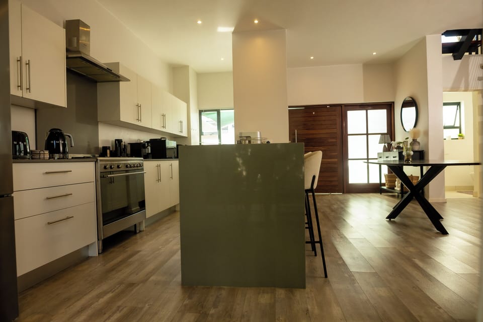 Modern open-plan kitchen with island and full self-catering facilities.
