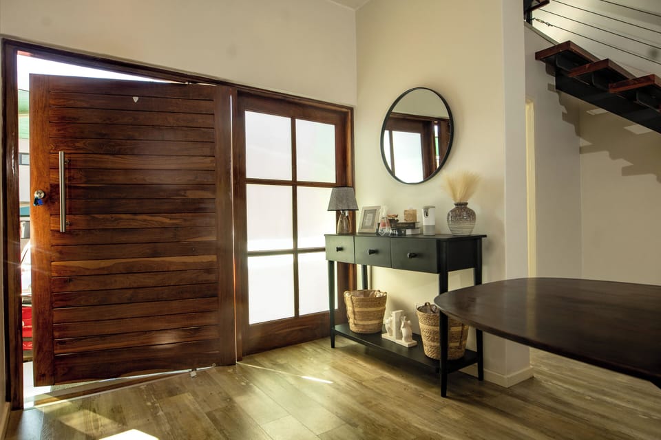 Elegant entrance hall with modern décor and staircase access.