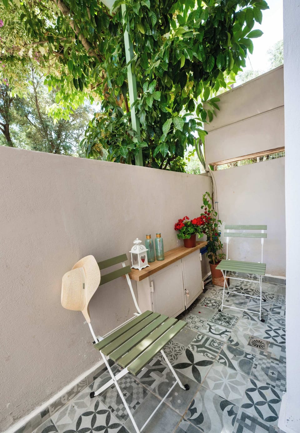 The private courtyard gives you a calm outdoor place for morning coffee, evening drinks, and quiet time between beach visits.