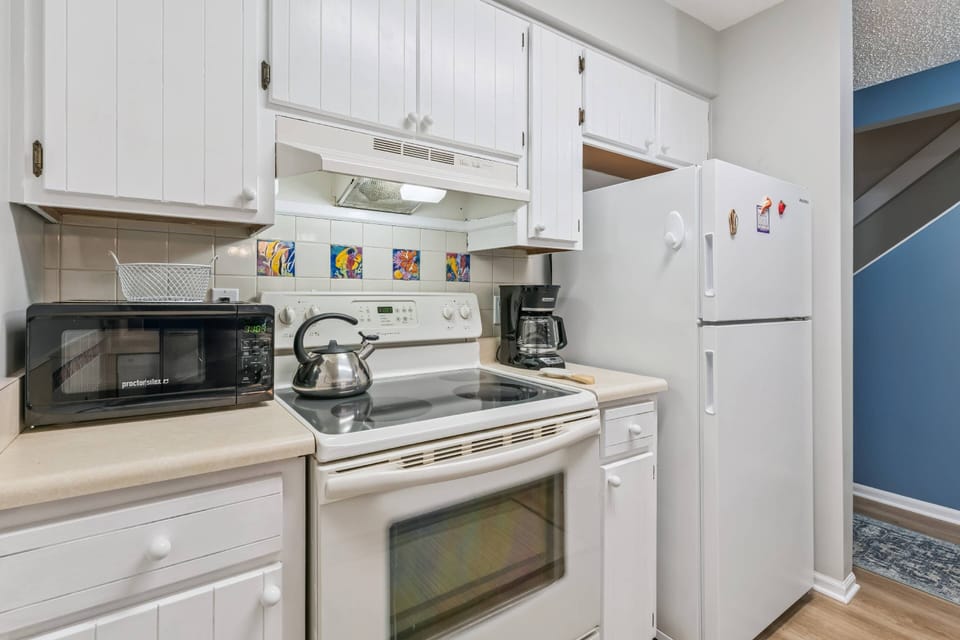 This charming kitchen comes with everything you'll need during your stay.