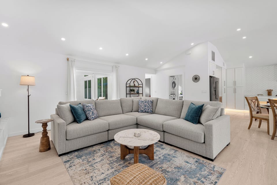 Sink into this spacious sectional in your airy open-concept living area - the perfect spot to unwind after a day of exploring.