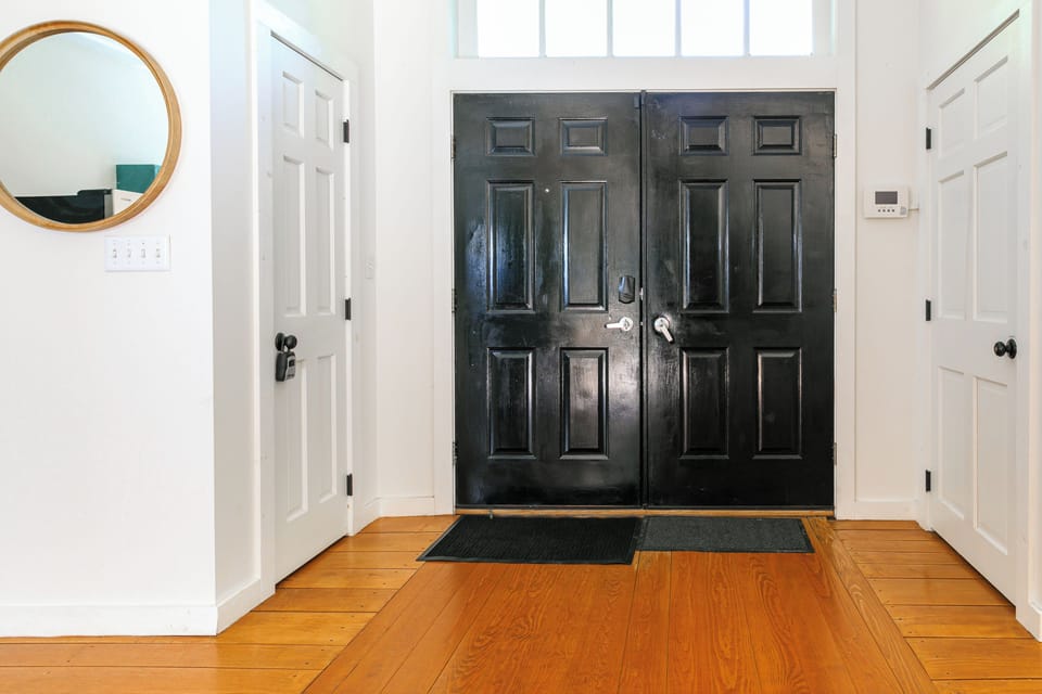 Welcoming entryway with keyless smart lock & original hardwood floors