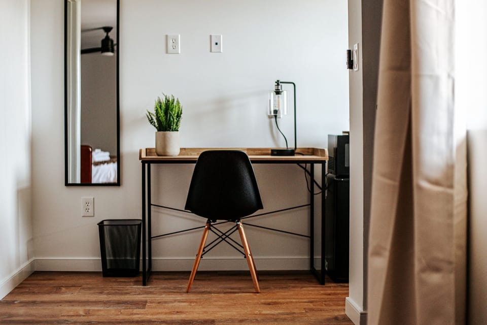 A well-organized workspace awaits, complete with greenery to keep your inspiration flowing.