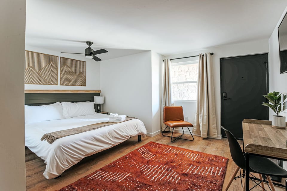 Unwind in a cozy space featuring warm tones, stylish decor, and a perfect spot to kick back after adventures.