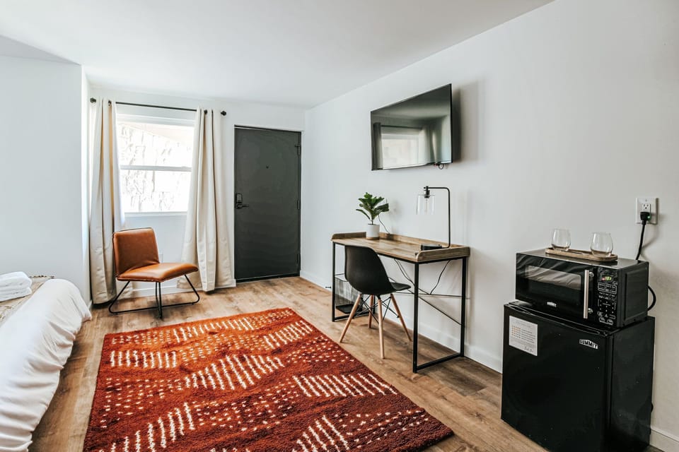 Unwind in a cozy nook with natural light and modern decor, perfect for relaxation after a day of exploration.