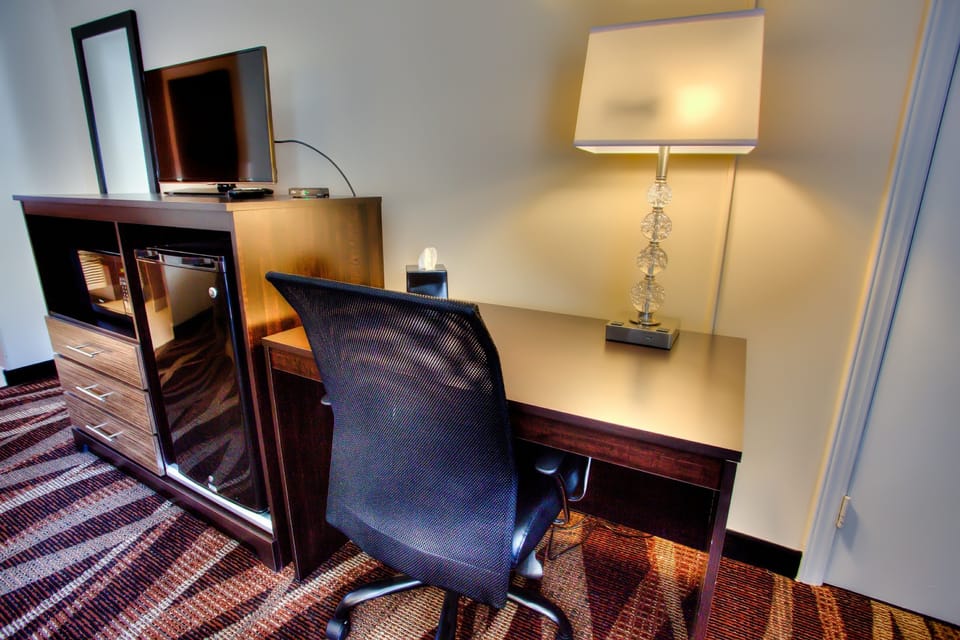 Desk, laptop workspace, blackout drapes, iron/ironing board