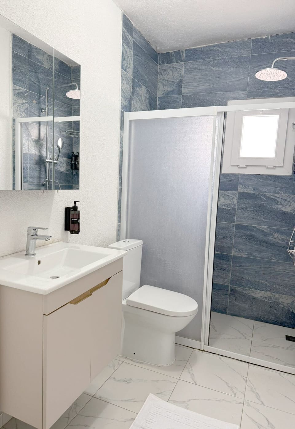 Shower, hair dryer, slippers, towels