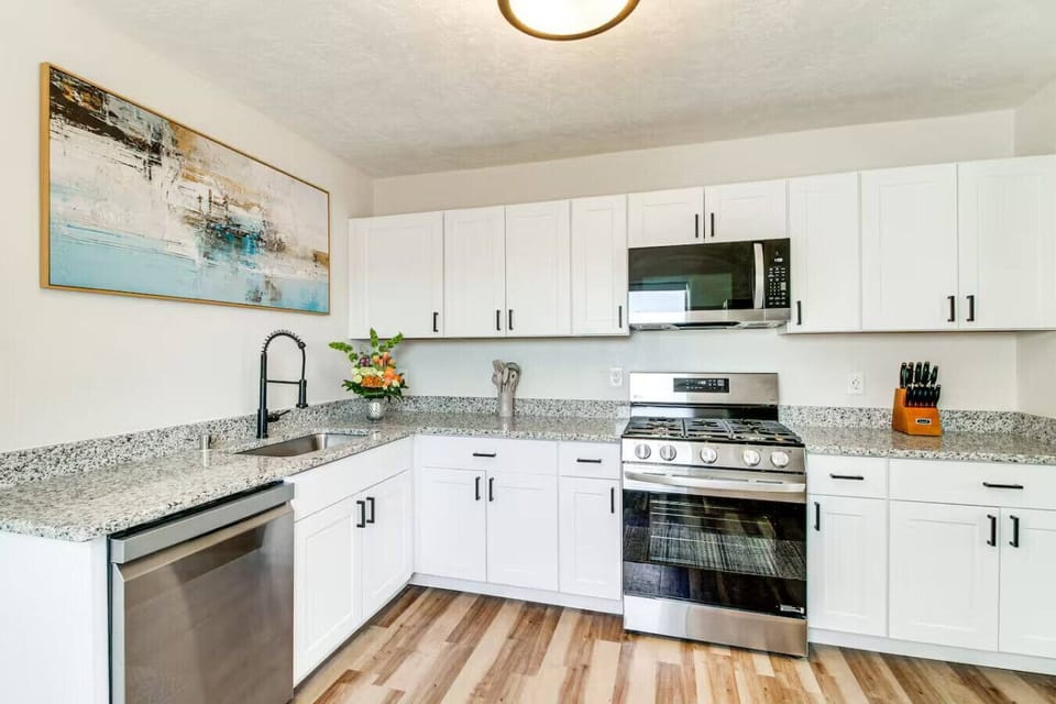 Fully equipped kitchen with gas range, stainless steel appliances, granite counters, and everything you need to actually cook. Keurig and starter coffee provided — mornings sorted.