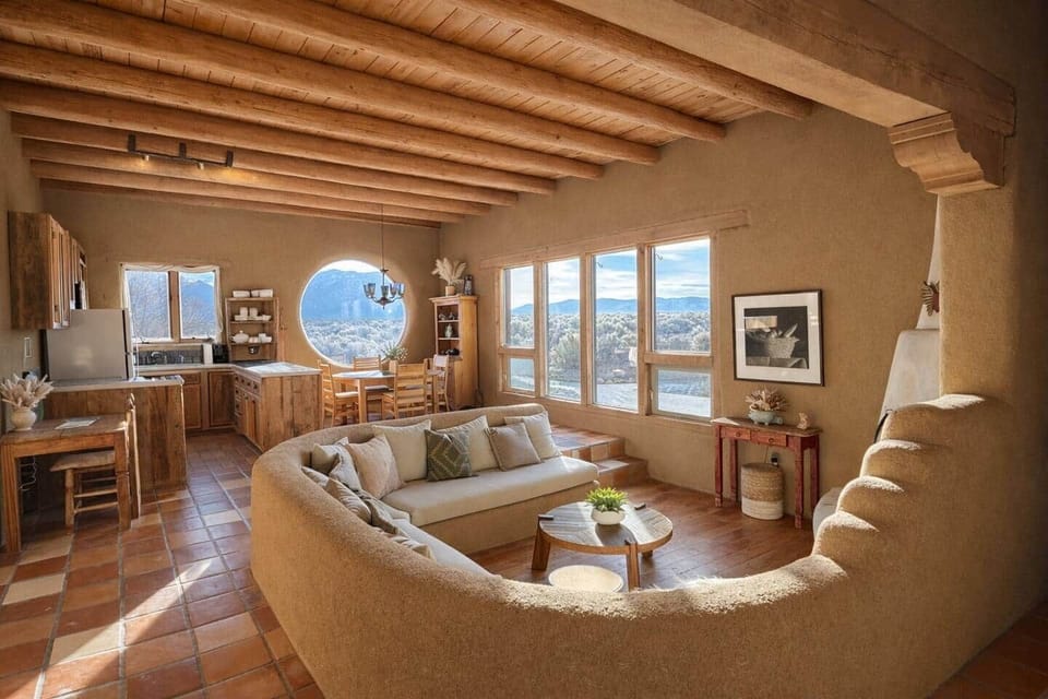 Relax by the kiva fireplace with panoramic desert and mountain views