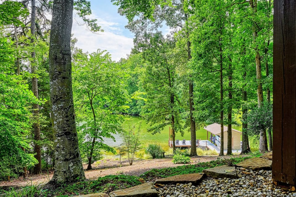 Wooded Waterfront - A path through mature trees opens to the cove and your private stretch of Lake Anna.