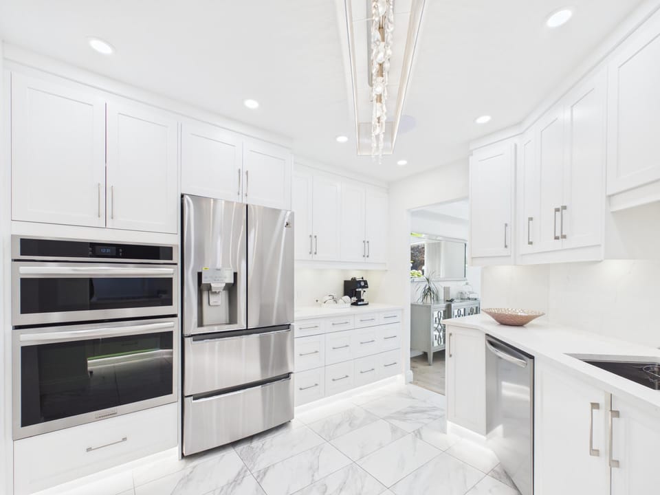 Under-cabinet task lights brightening every counter for easy food prep.