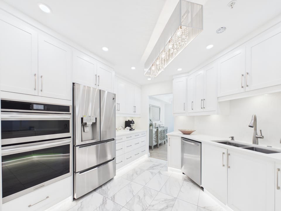High-end kitchen with double wall ovens—making meal prep for long stays a total breeze!