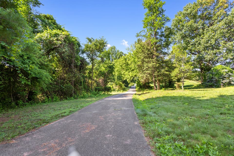 Flat, paved driveway for 3-4 cars easy parking.