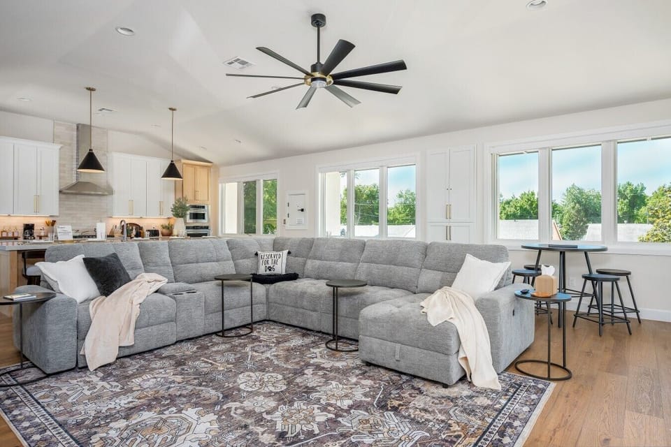 Living Room | Sectional Sofa | Open Kitchen Layout & Natural Light