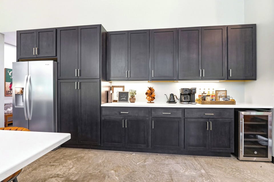 Savor slow mornings and easy entertaining with a stylish coffee bar, generous storage, and everything you need within reach.
