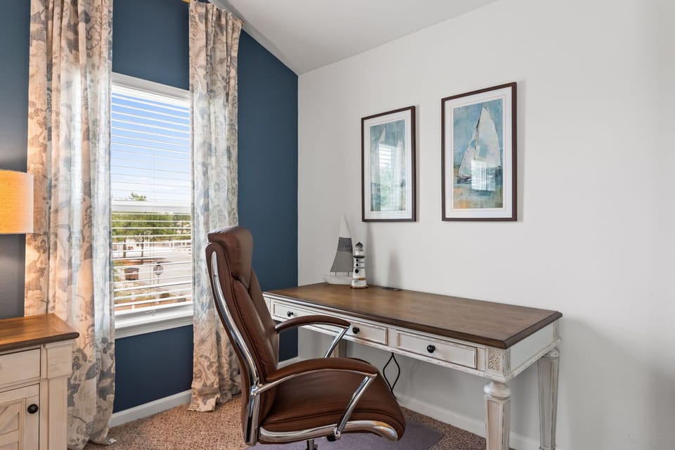 Bright, stylish workspace with natural light and a comfortable desk setup