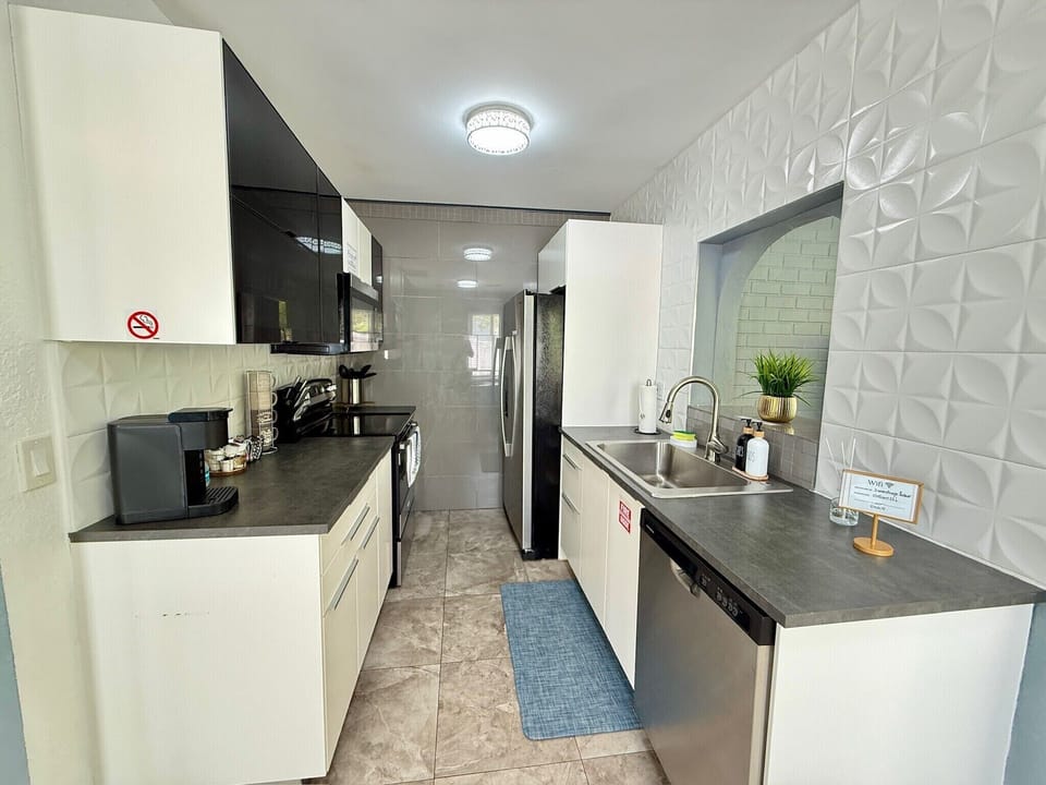 Bright modern kitchen with stainless appliances and stylish finishes
