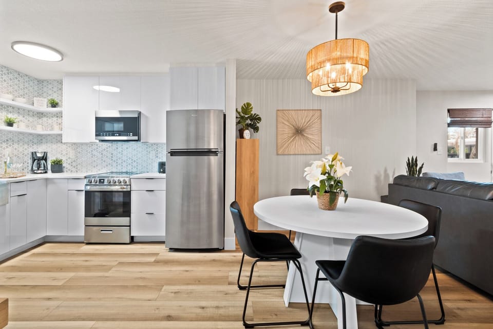 Kitchen seamlessly flows into dining area and living room creating an open layout
