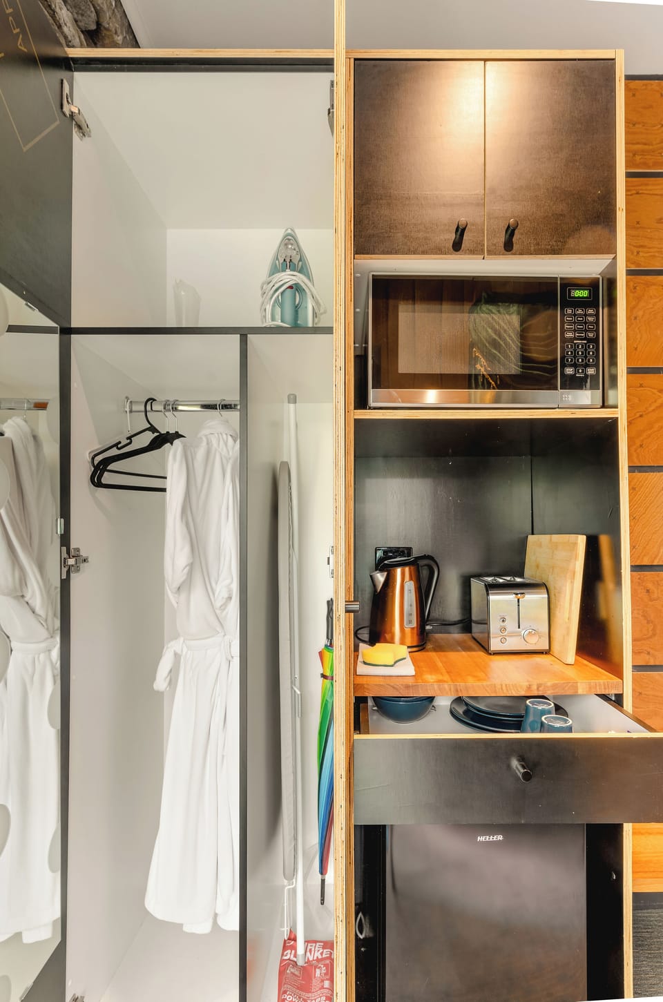 Compact kitchenette, mini-fridge, and cozy robes—ready for your stay