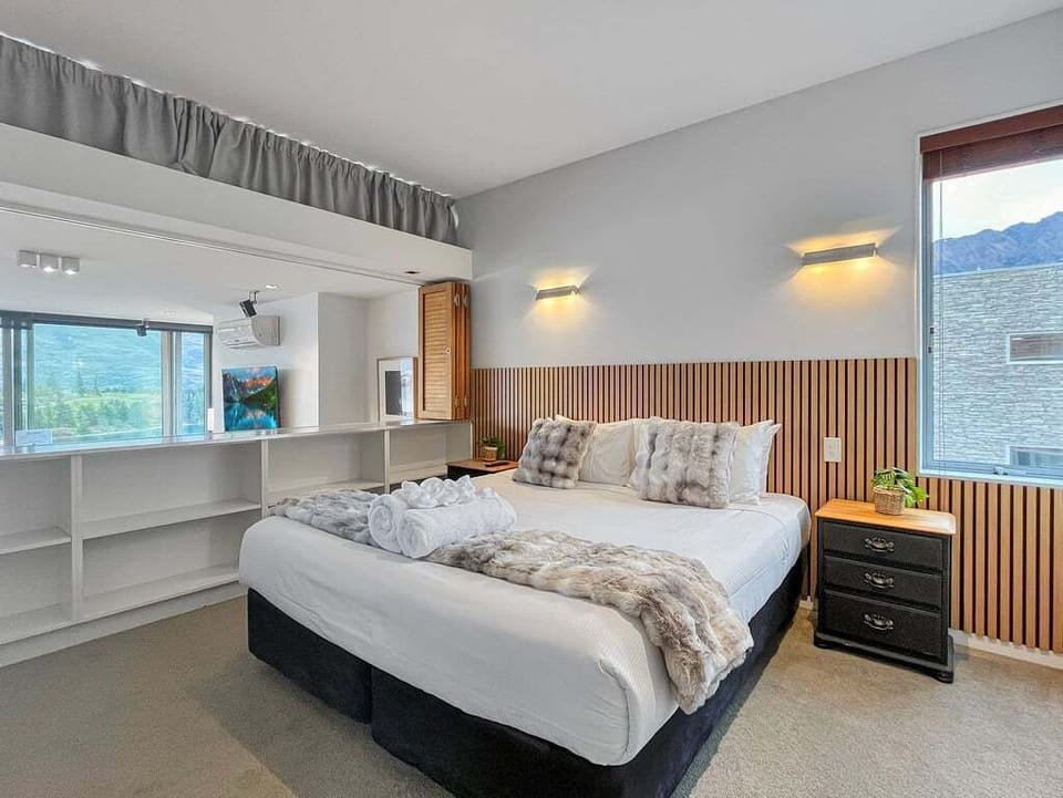 Relax in a spacious king bedroom designed for comfort and restful nights.