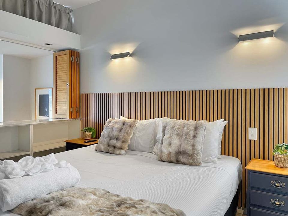 Plush bedding and thoughtful touches create a warm and inviting retreat.