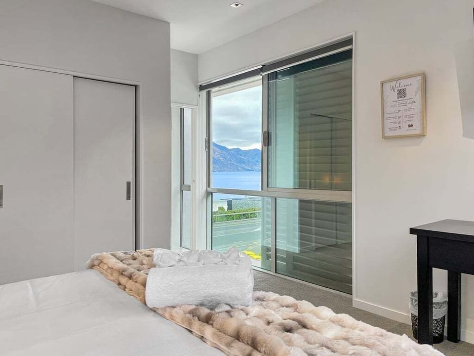 Take in beautiful lake and mountain views from your bed. 
