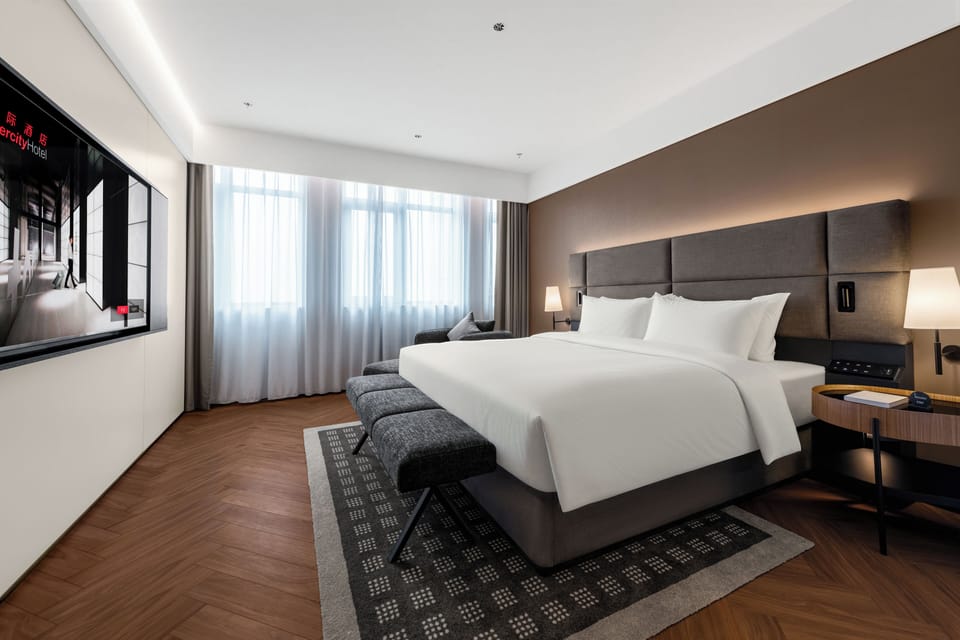 Luxury Suite, City View | Desk, laptop workspace, blackout drapes, iron/ironing board