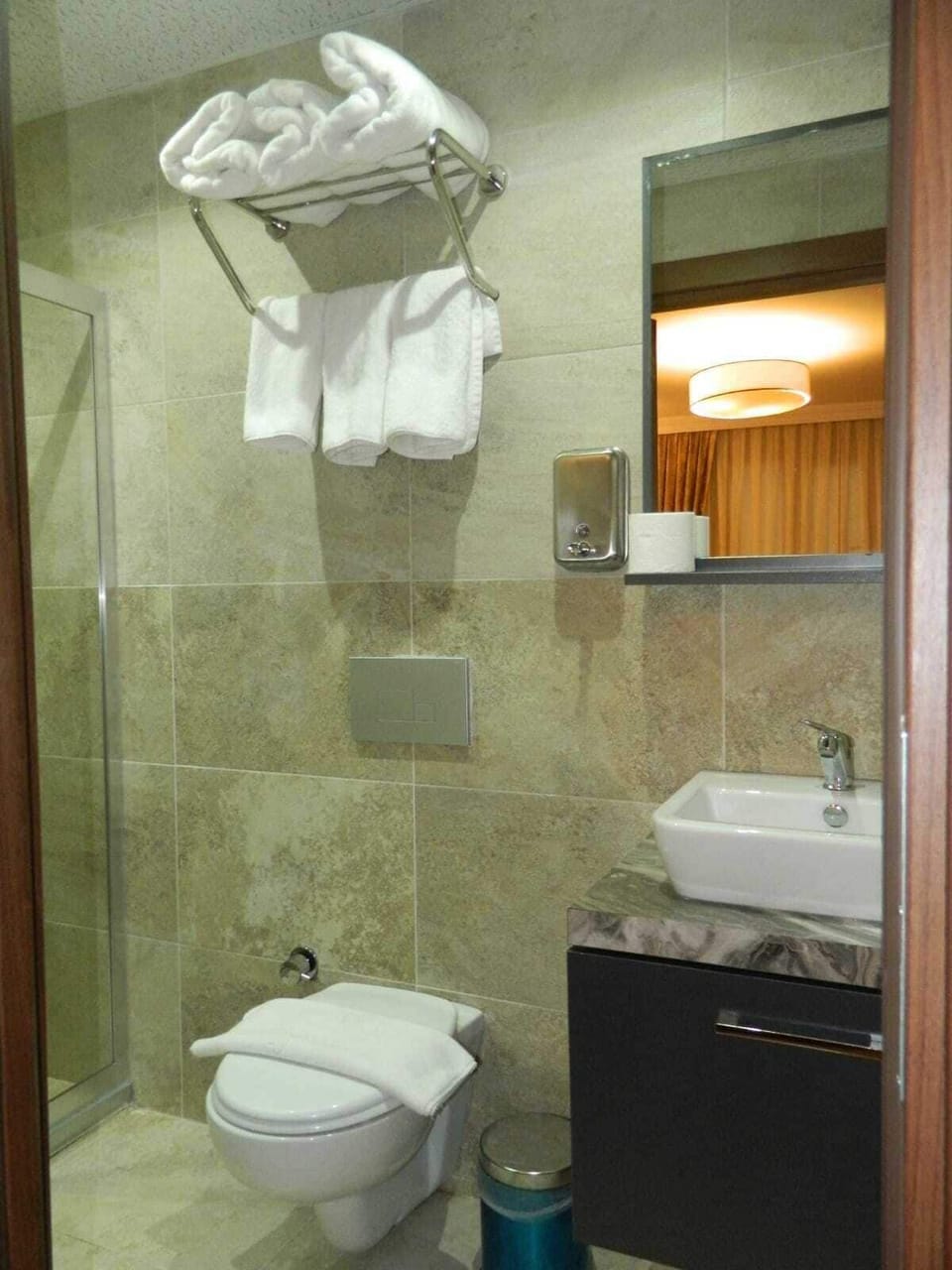 Shower, slippers, towels, soap