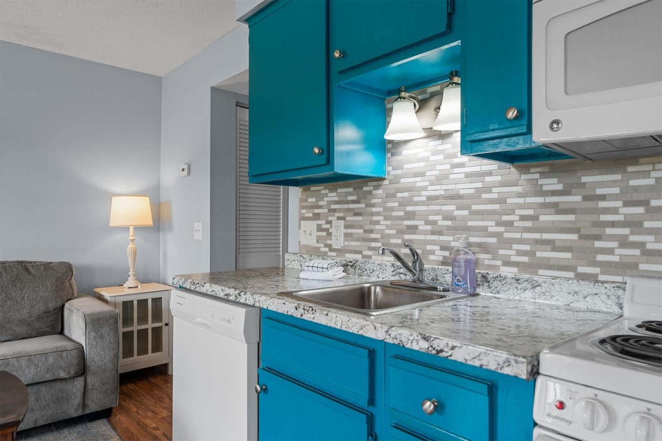 The cheerful kitchen is well equipped with all the comforts of home​