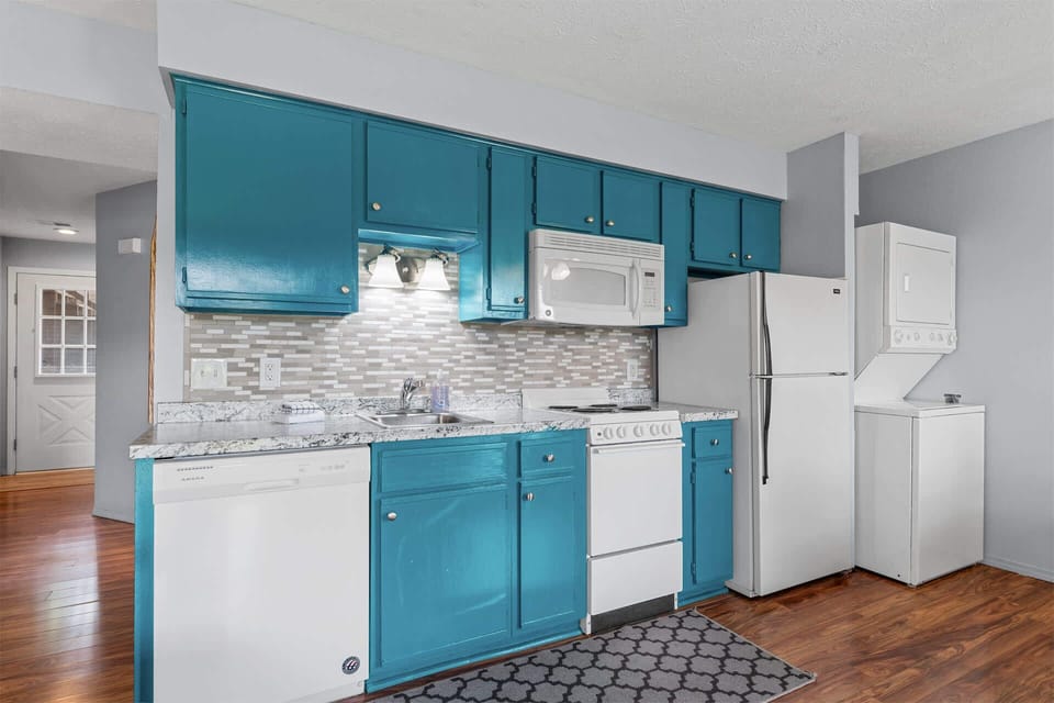 The cheerful kitchen is well equipped with all the comforts of home​