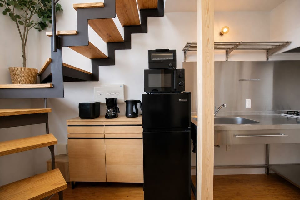 Deluxe Apartment, Balcony | Private kitchen | Full-size fridge, toaster, rice cooker, cookware/dishes/utensils