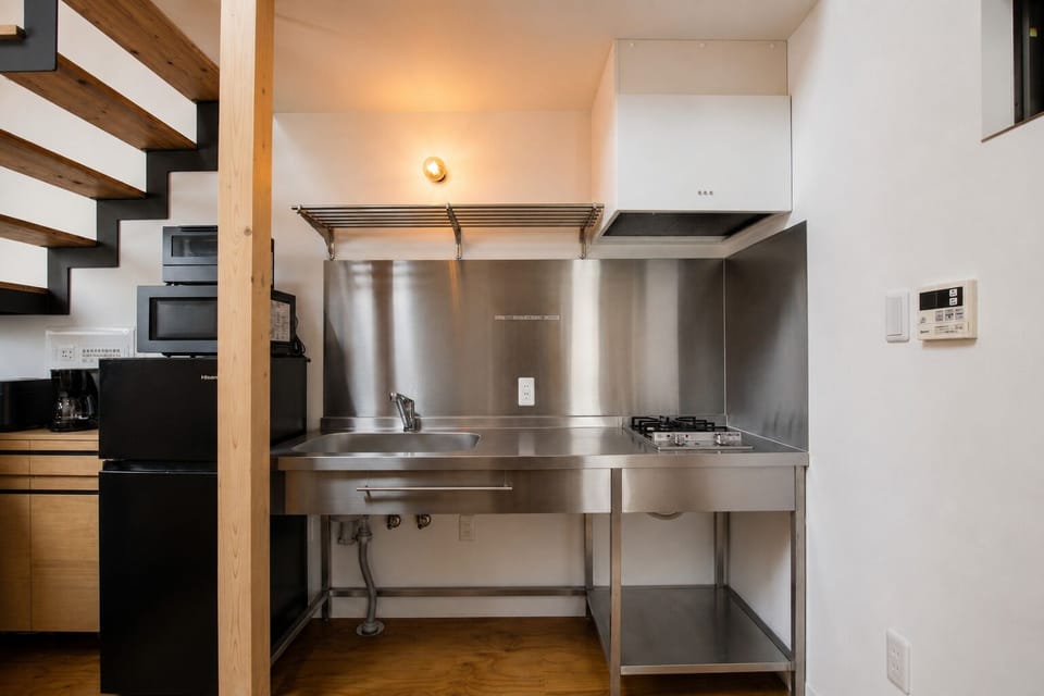 Deluxe Apartment, Balcony | Private kitchen | Full-size fridge, toaster, rice cooker, cookware/dishes/utensils